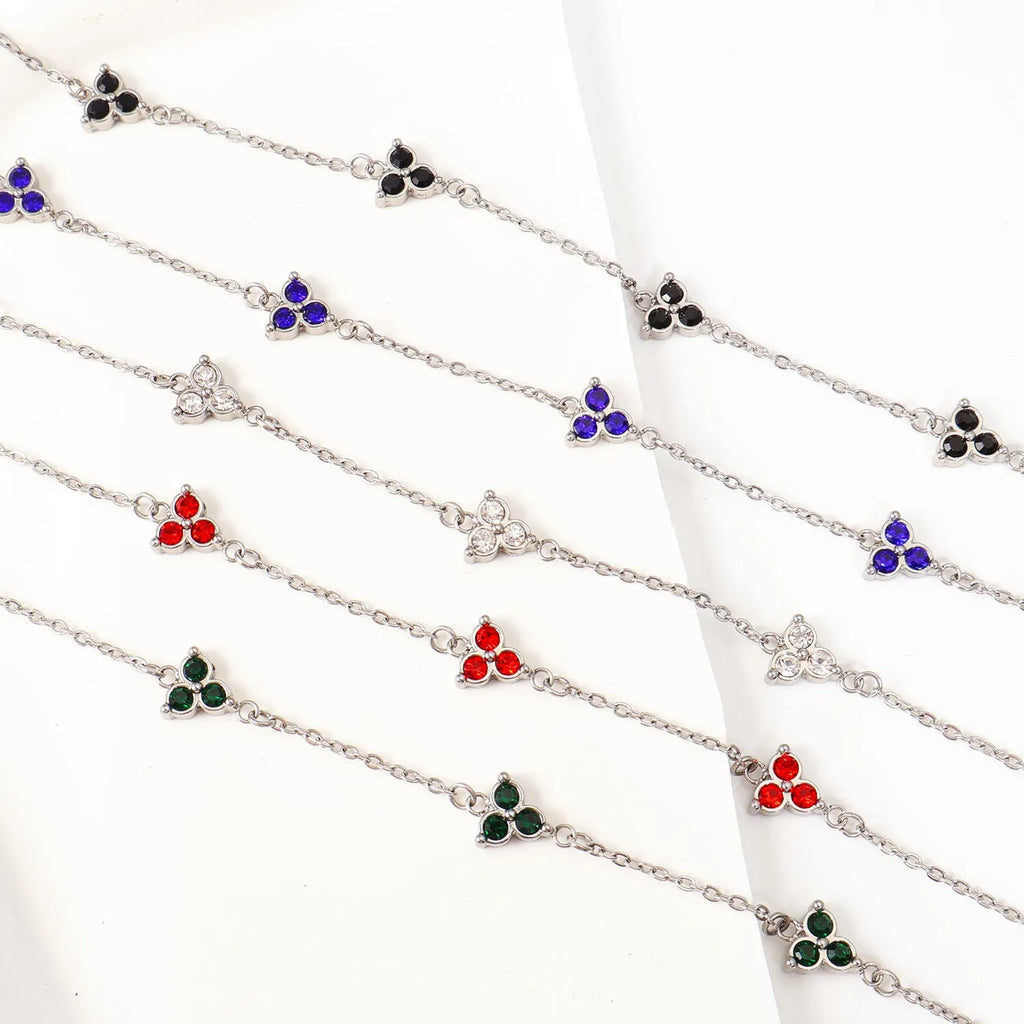 Women's stainless steel geometric bracelet with three diamond triangle design and coloured stone accents