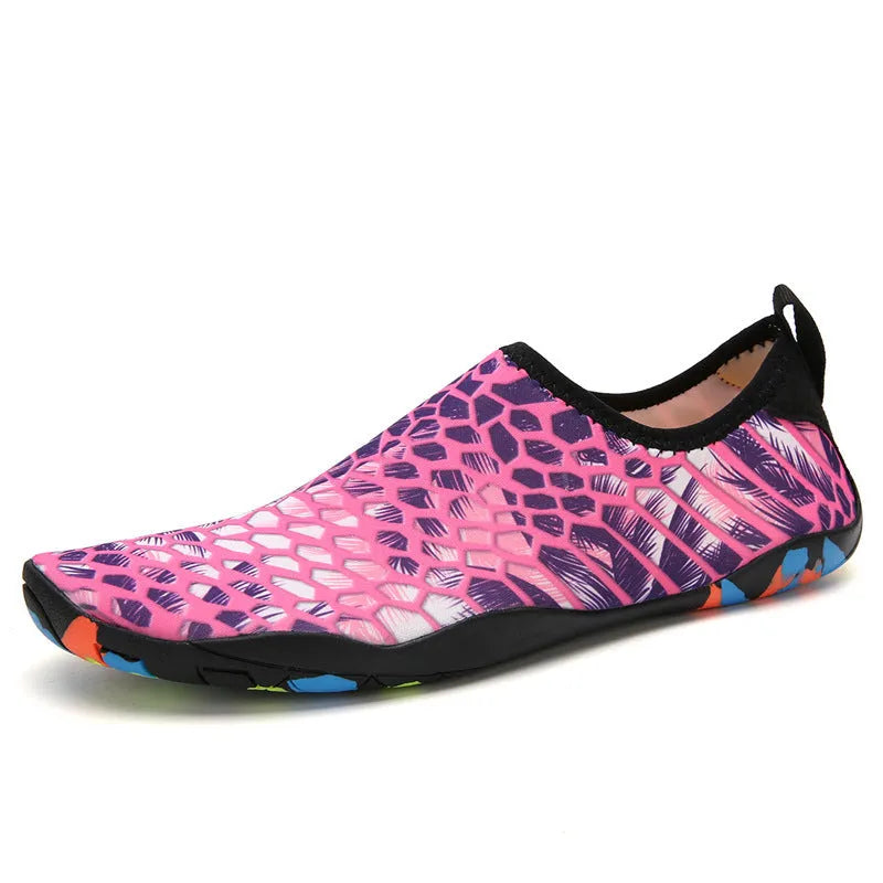 Lycra beach wading shoes with EVA midsole in blue, shown on a sandy shore.