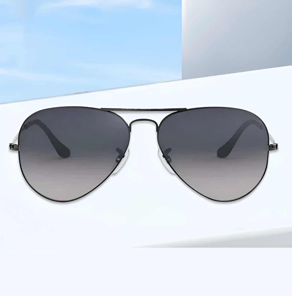 Tempered glass sunglasses with gold frame and dark green lenses for UV protection.