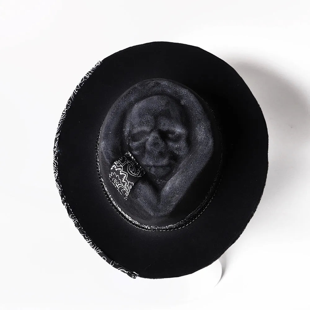 Handmade wool felt skull hat with a conical crown on a model, monochrome print.