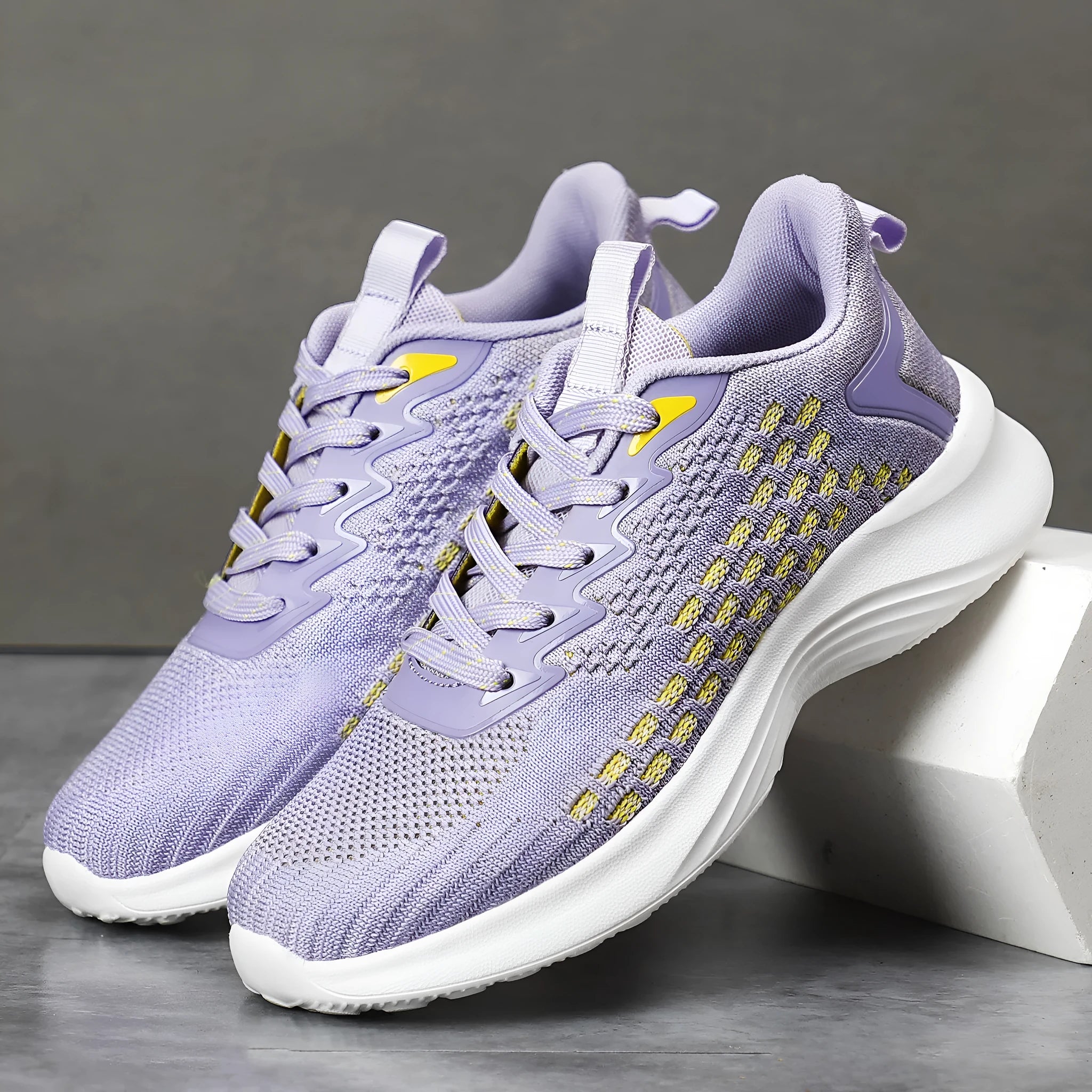 Lavender purple women's Flyknit running shoes with mesh upper and striped pattern on an EVA sole.