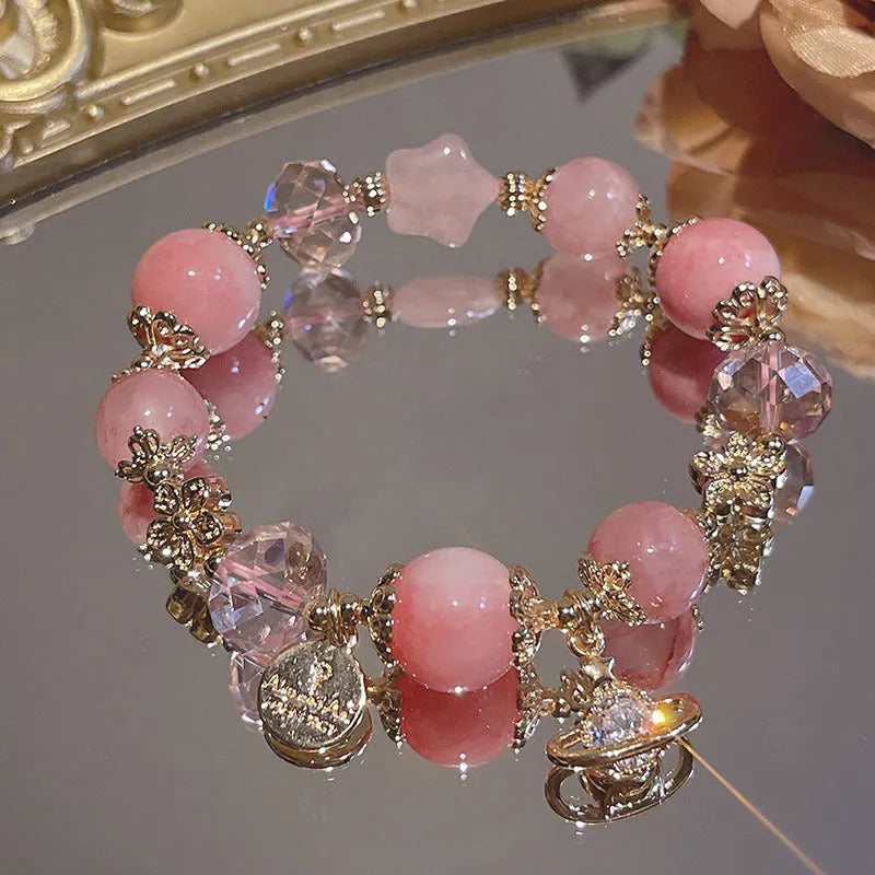 Women's bracelet with snowflake pendant and bow charm in galaxy colours on alloy construction