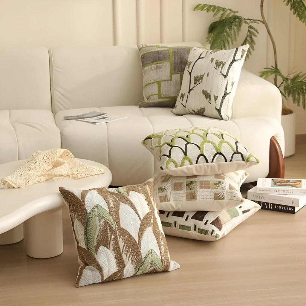 45cm square jacquard cushion cover with detailed floral pattern in retro Nordic style, shown in one of eight available colours.