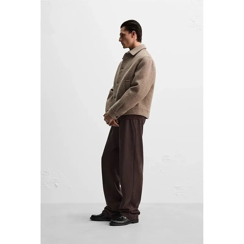 Men's taupe loose wool woven lapel long sleeve single-breasted casual jacket coat on a model