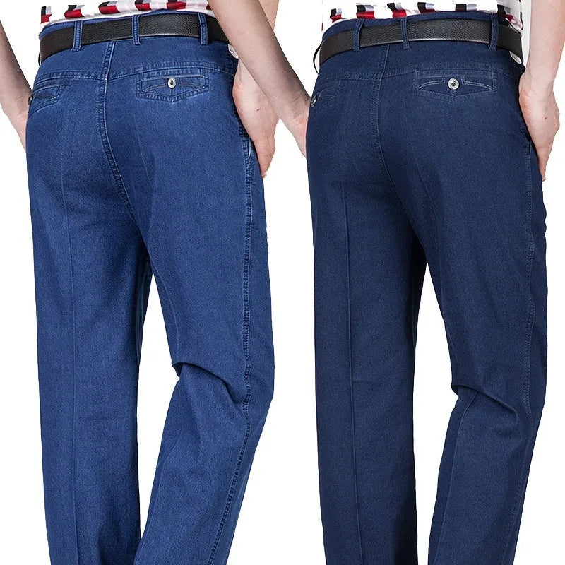 Men's high-waist loose fit blue denim jeans with zipper fly on size chart background