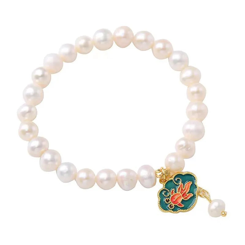 White freshwater pearl goldfish and lotus bracelet with vintage baroque design on delicate chain