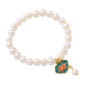 White freshwater pearl goldfish and lotus bracelet with vintage baroque design on delicate chain