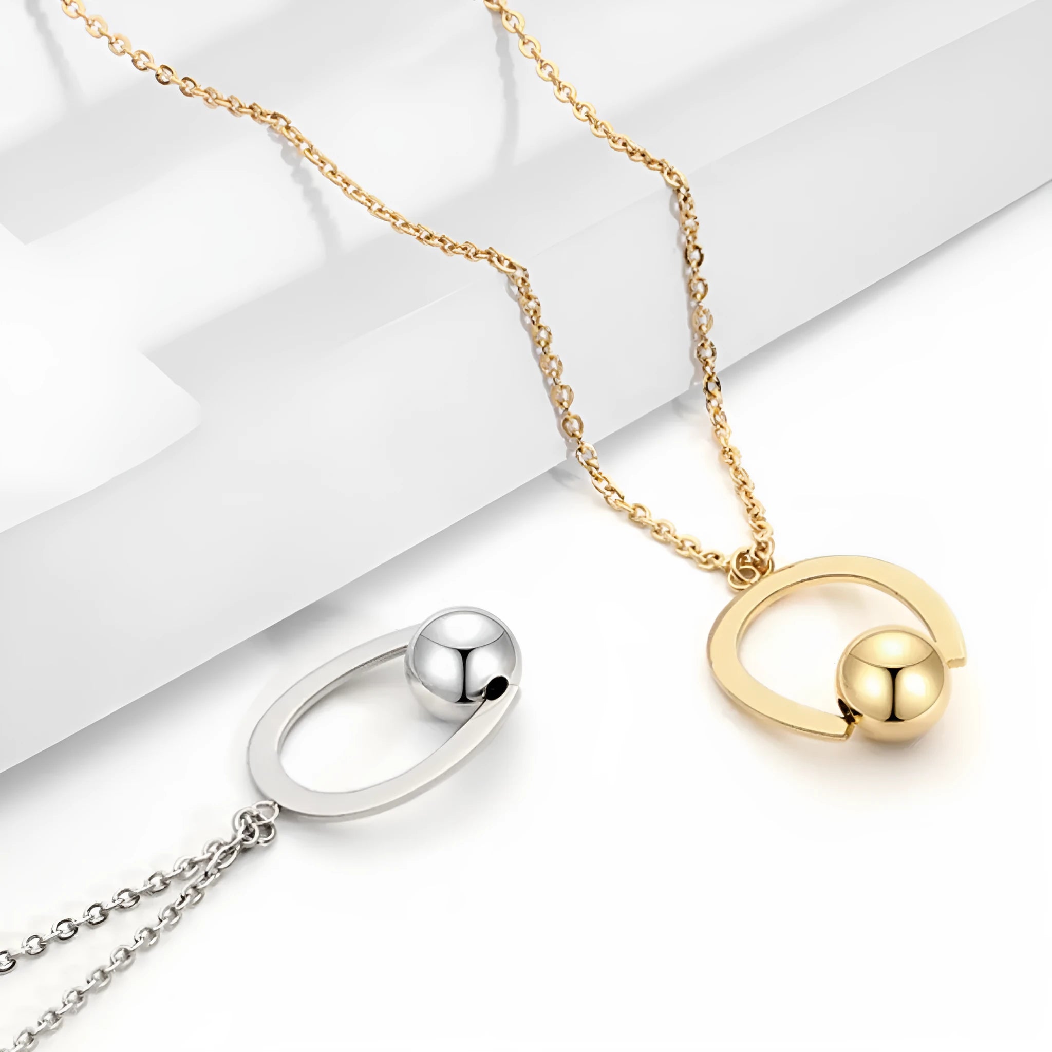 Gold stainless steel geometric pendant necklace on a cross chain, adjustable from 21cm to 50cm