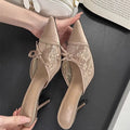 Women's lace-inspired pointed toe high heels with a bowknot detail on the mesh upper.