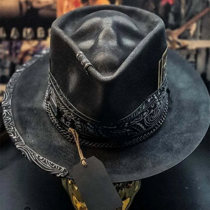 Handmade wool felt skull hat with a conical crown on a model, monochrome print.
