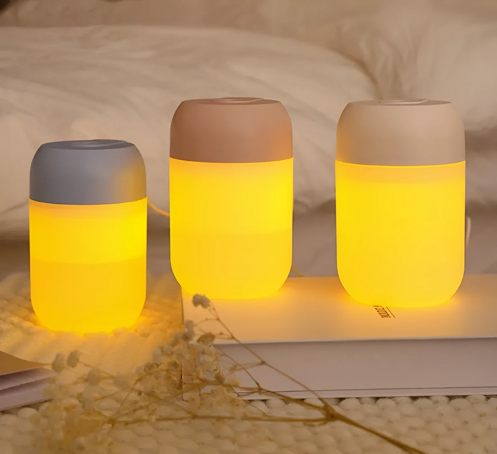 Small white cylindrical USB-powered humidifier for silent bedroom and desk use.