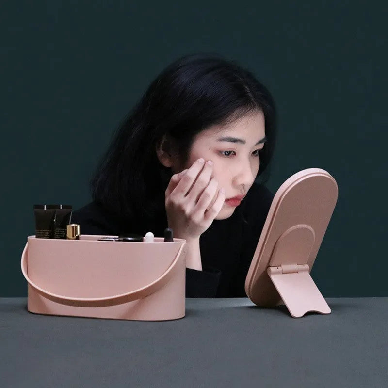 Pink portable plastic storage box with a built-in aluminium makeup mirror