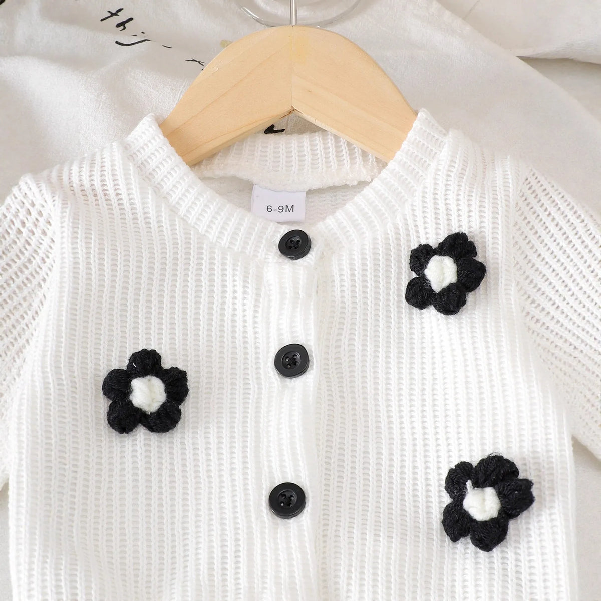 White floral long sleeve top and black trousers baby outfit set in cotton, sizes 6-9M to 2-3Y