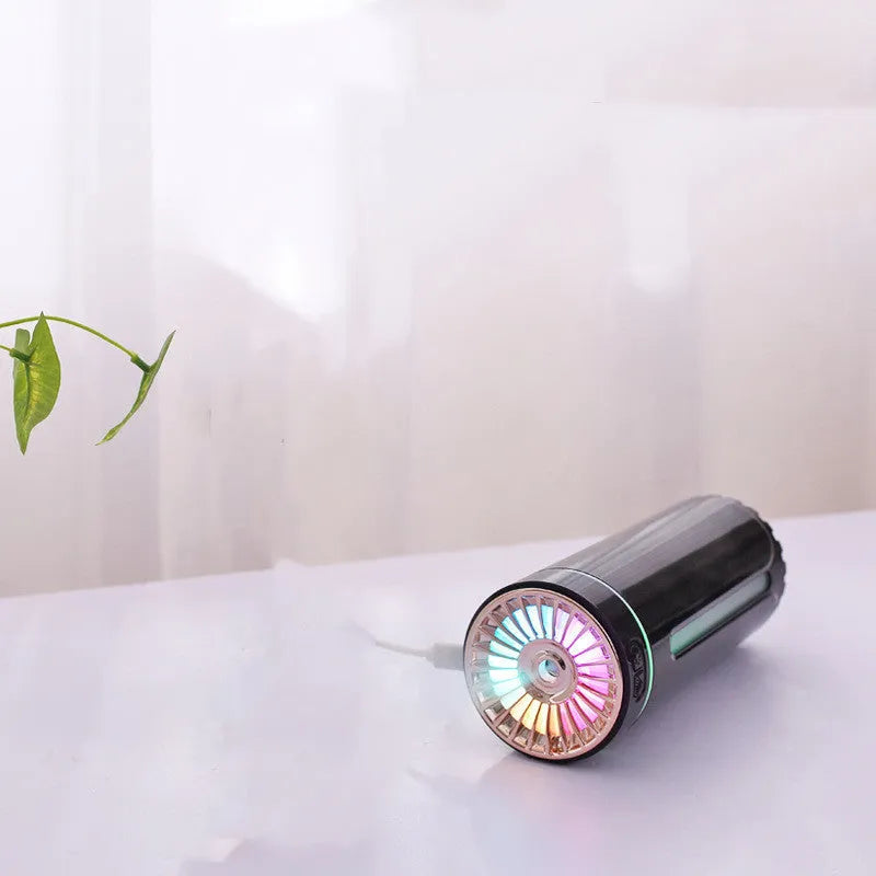Black portable car humidifier with colourful lights on a car dashboard cup holder
