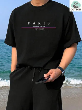 Man wearing a loose-fitting short-sleeved pure cotton t-shirt with a printed design in apricot colour.