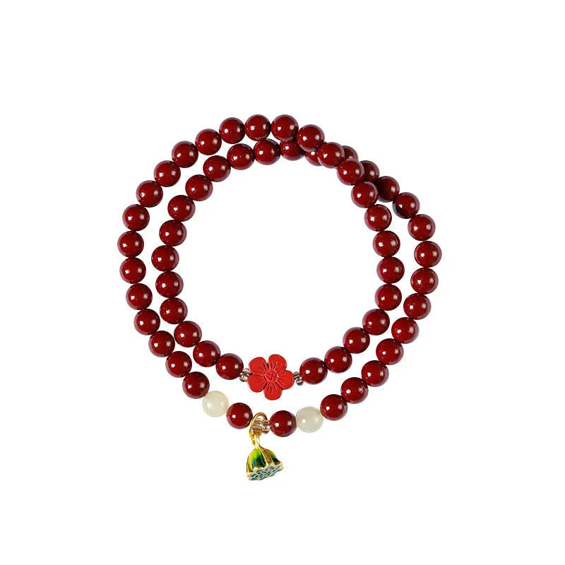Hand-woven double circle bracelet with purple gold cinnabar beads and lotus design