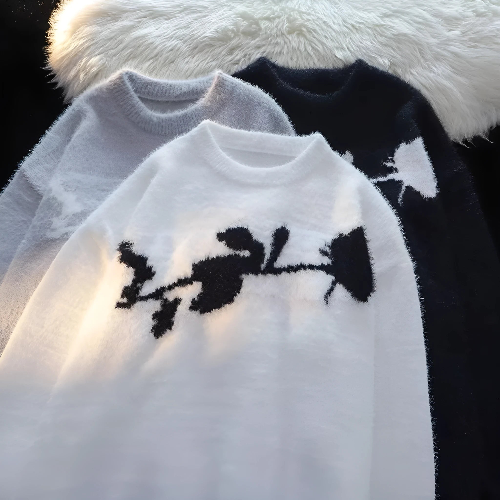 Men's black pullover sweater with a large flocking print of a rose and horse design on the chest.