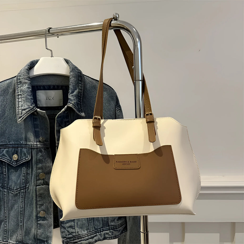 Horizontal square PU tote bag for women in black, showing external sandwich pocket and double shoulder straps.