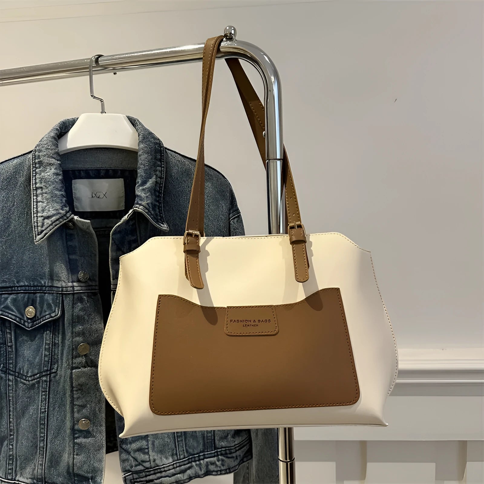Horizontal square PU tote bag for women in black, showing external sandwich pocket and double shoulder straps.