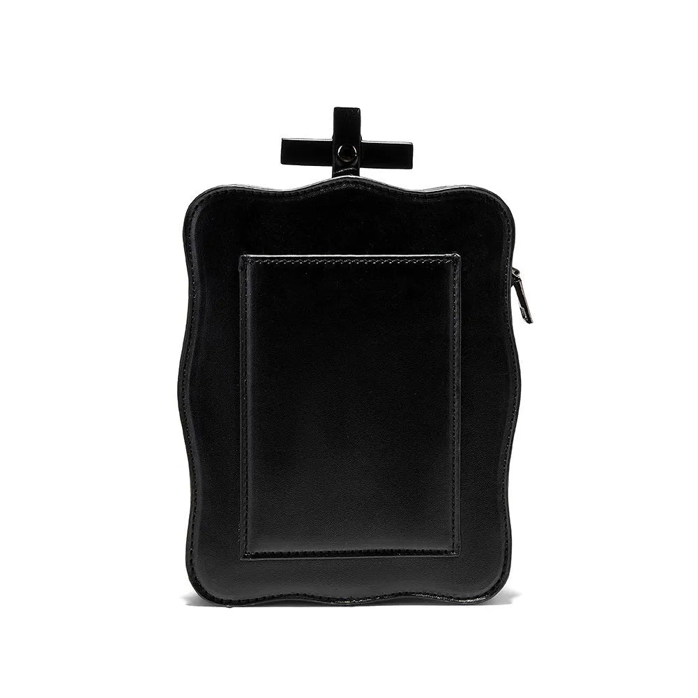 Black square mini crossbody bag with embroidered skull design, metal rivets, and a chain shoulder strap.