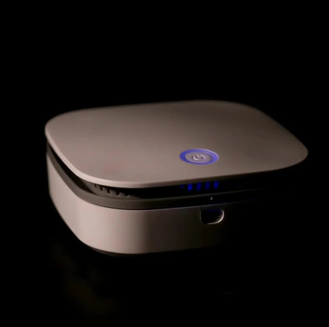 White portable USB air purifier with button control for car and small room use.