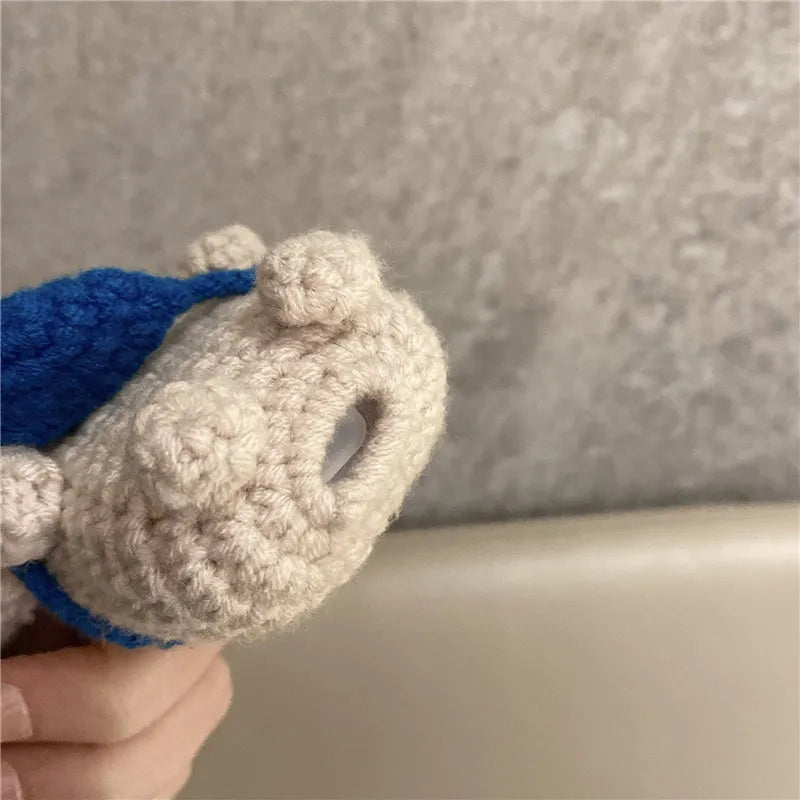 Hand-knitted koala bear backpack design cover for Apple AirPods case.