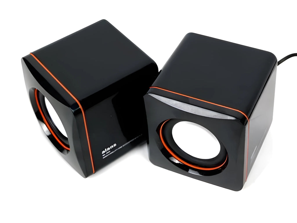 Black square USB-powered 2.0 desktop computer speaker on a desk.