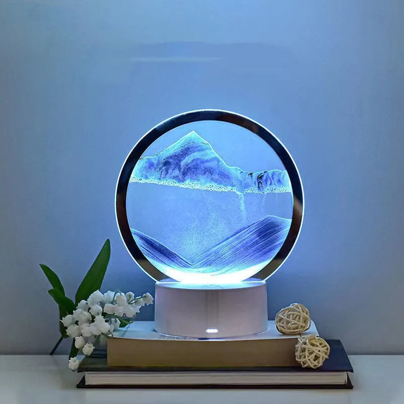 Creative 3D quicksand table lamp with glass shade and USB power cord on a wooden surface.