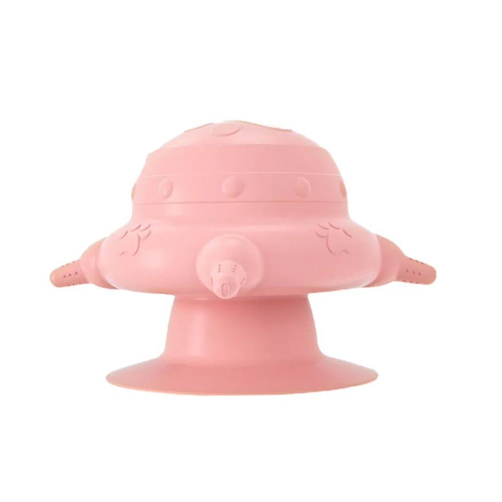 Pink silicone pet nursing bottle with four teats and a flat base.