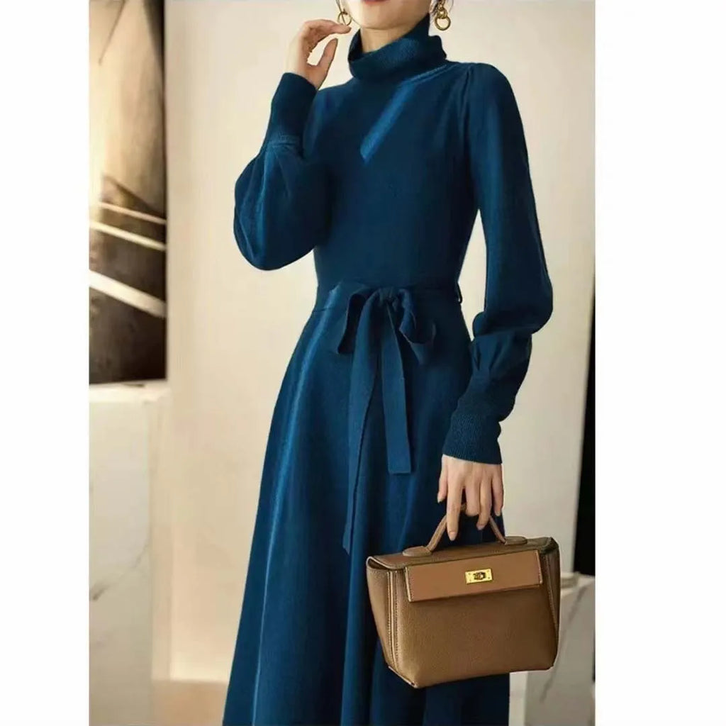 Women's rose red turtleneck knitted dress with long sleeves and a mid-length skirt.