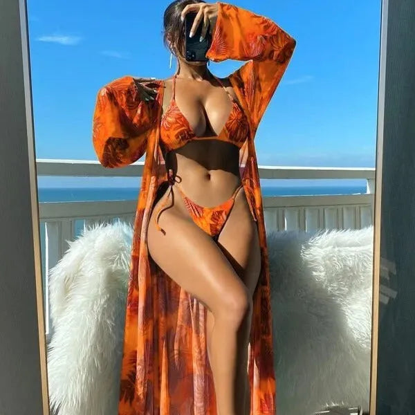 Women's long sleeve floral swimsuit bikini set with matching robe.