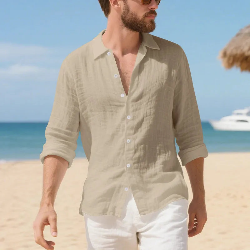 Linen Hawaiian casual shirt in a loose fit, shown in an earthy yellow colour on a hanger.