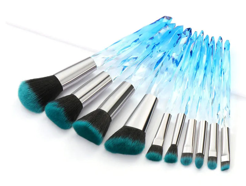 10 clear crystal handle foundation brushes with diamond shank design and black bristles.