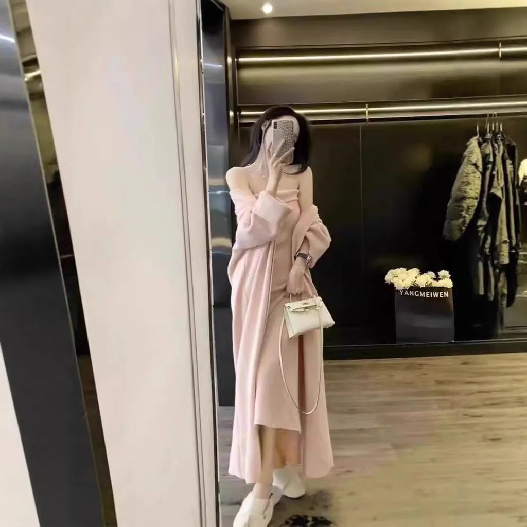 Women's grey knitted cardigan dress and matching coat set on a hanger.