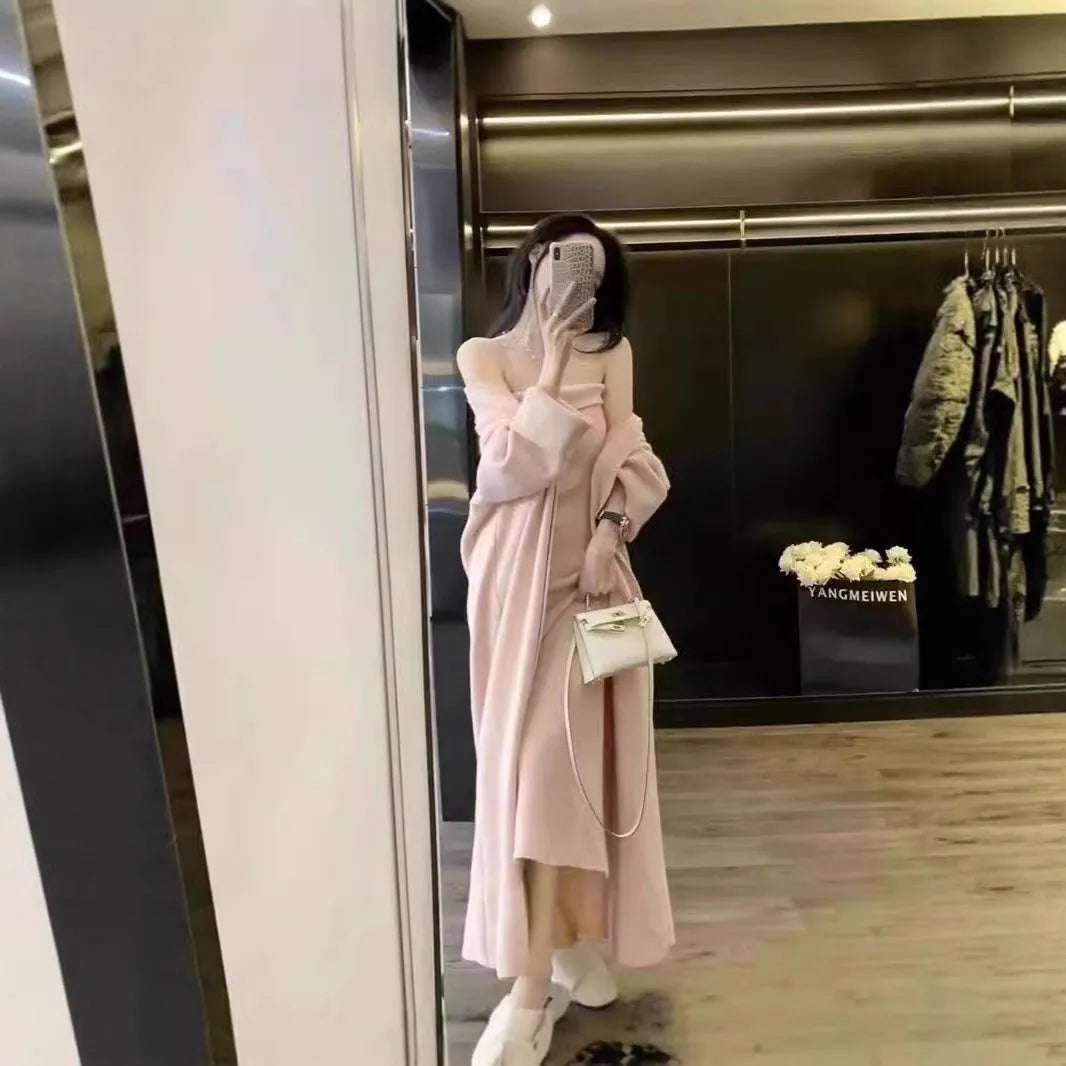 Women's grey knitted cardigan dress and matching coat set on a hanger.