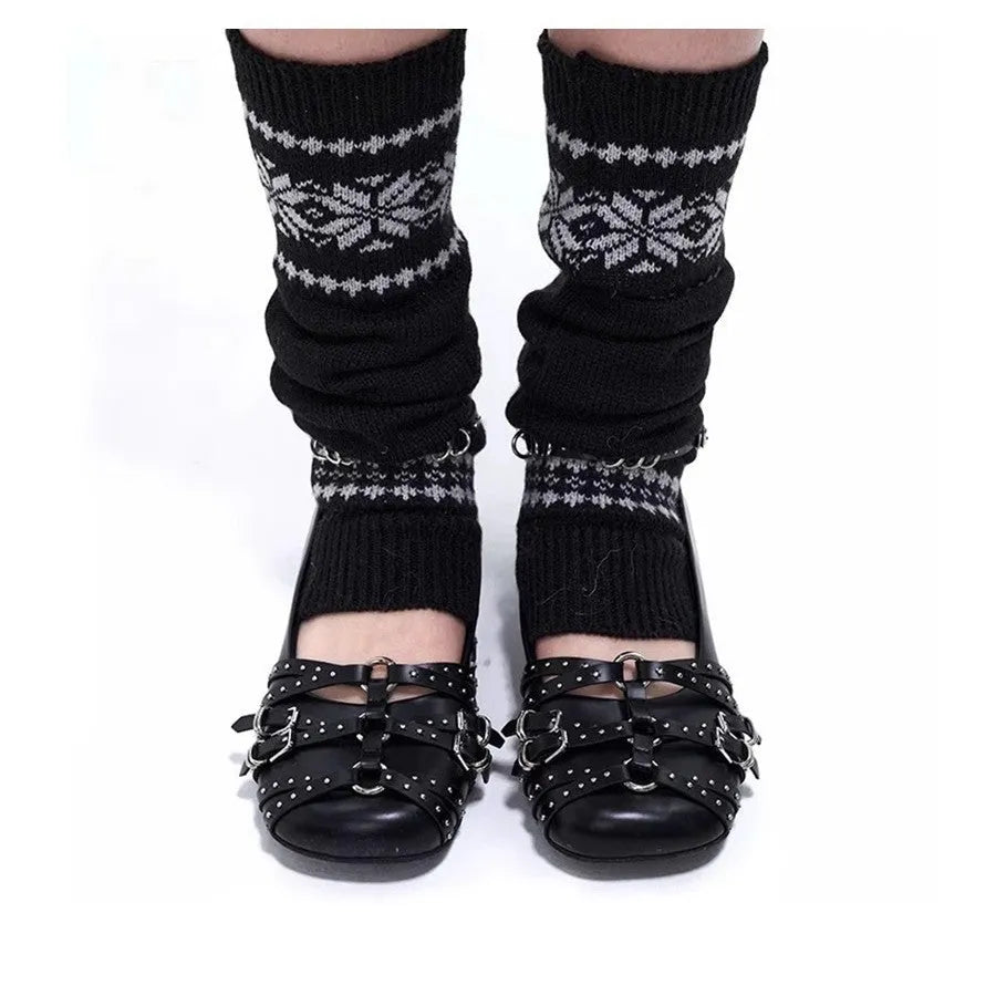 Women's black patent leather buckle pumps with a square toe and low flat heel on a white background.