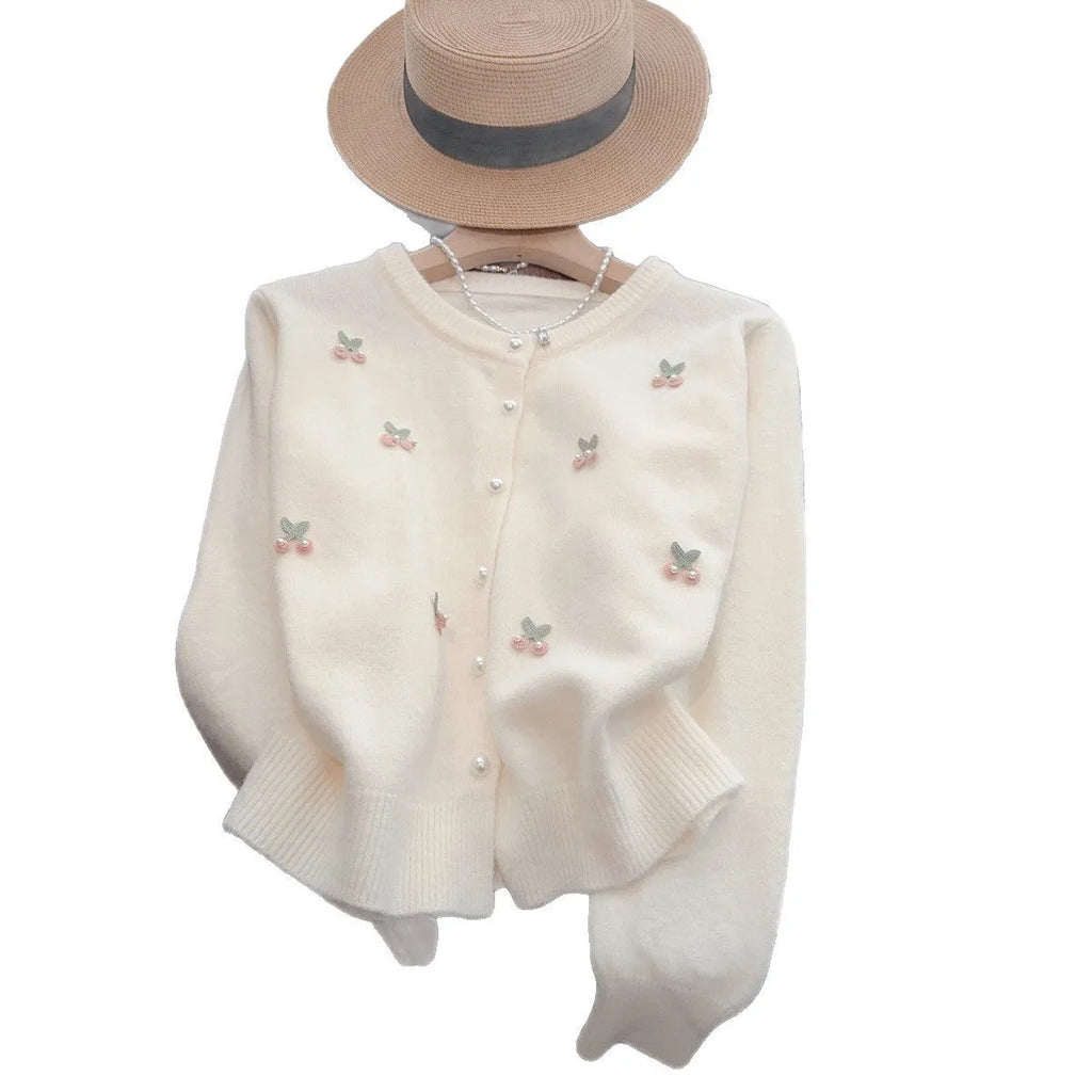 Women's pink cashmere cardigan sweater coat with bead detailing, round neck, and slim fit.