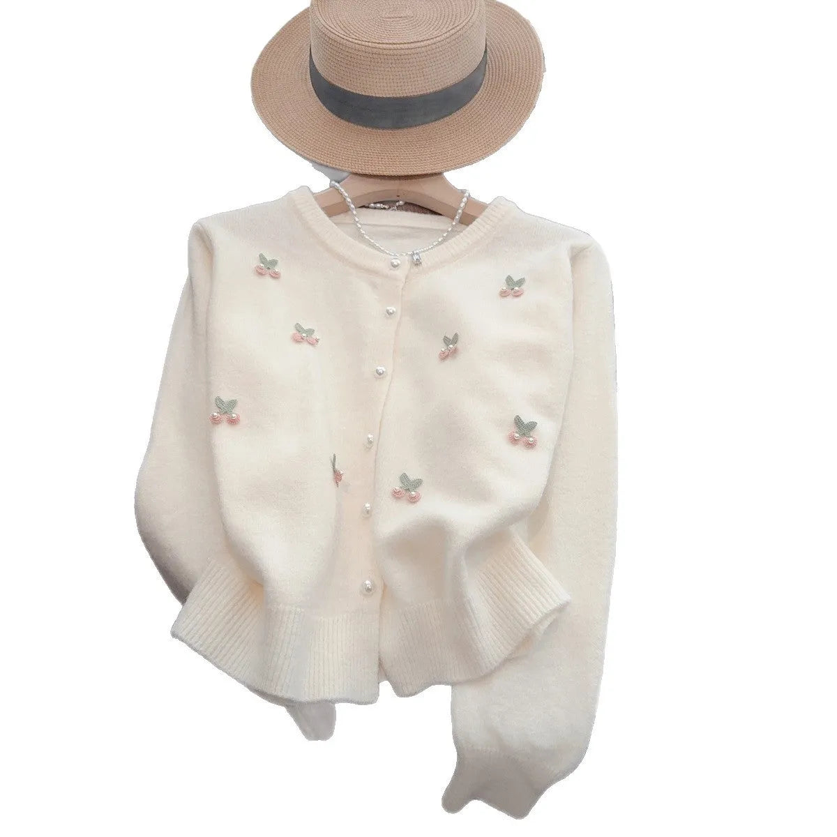 Women's pink cashmere cardigan sweater coat with bead detailing, round neck, and slim fit.