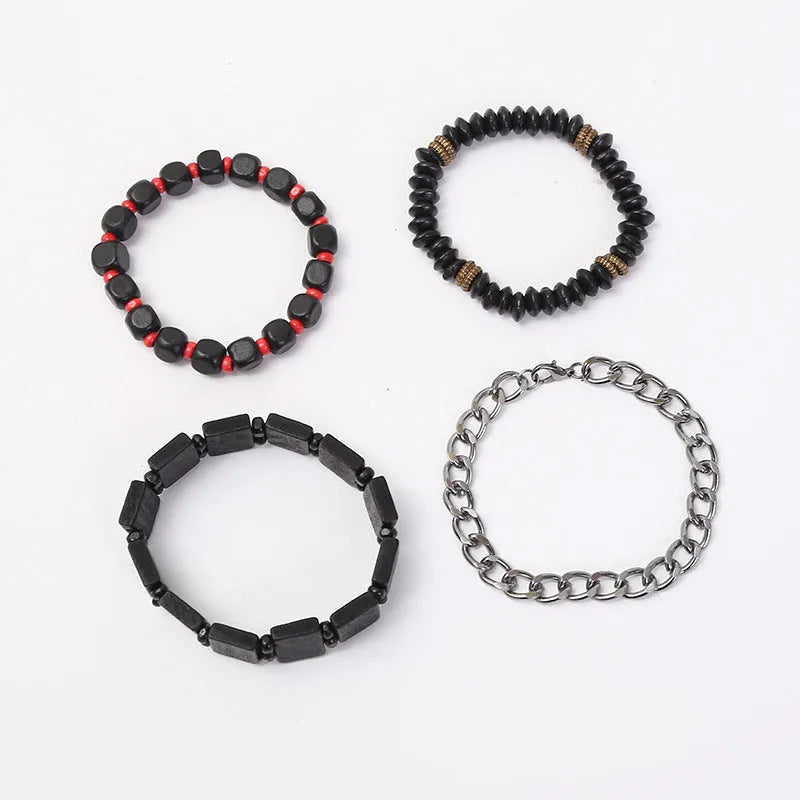 Set of four handmade retro woven alloy bracelets in different colours on a neutral background