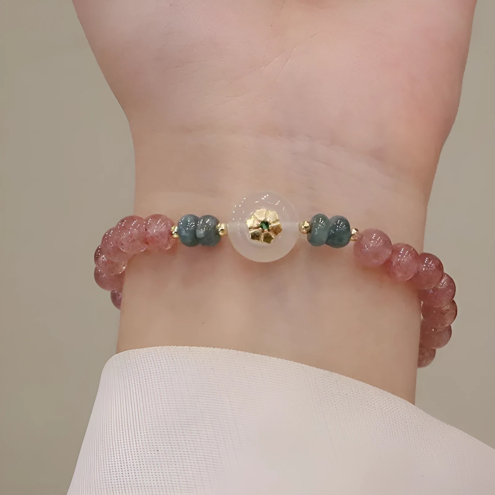 Women's strawberry quartz bracelet with blue water emerald round jade pendant, geometric diamond design with Ruyi and peace buckle elements