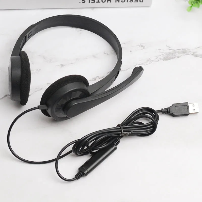 Black USB wired gaming headset with microphone, sponge ear pads and PVC cable for PC computer use