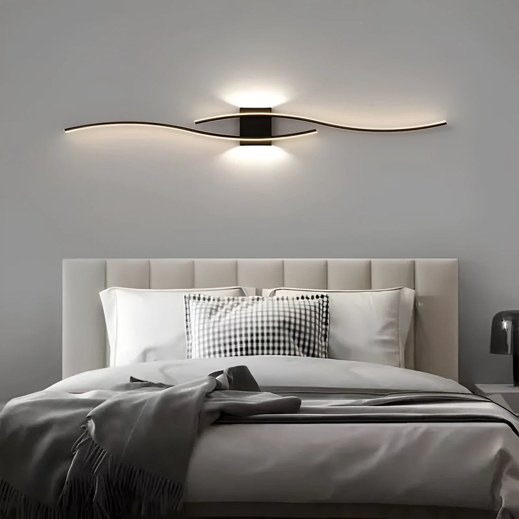 Black 60cm bedside wall lamp with acrylic panel and wrought iron frame on neutral wall