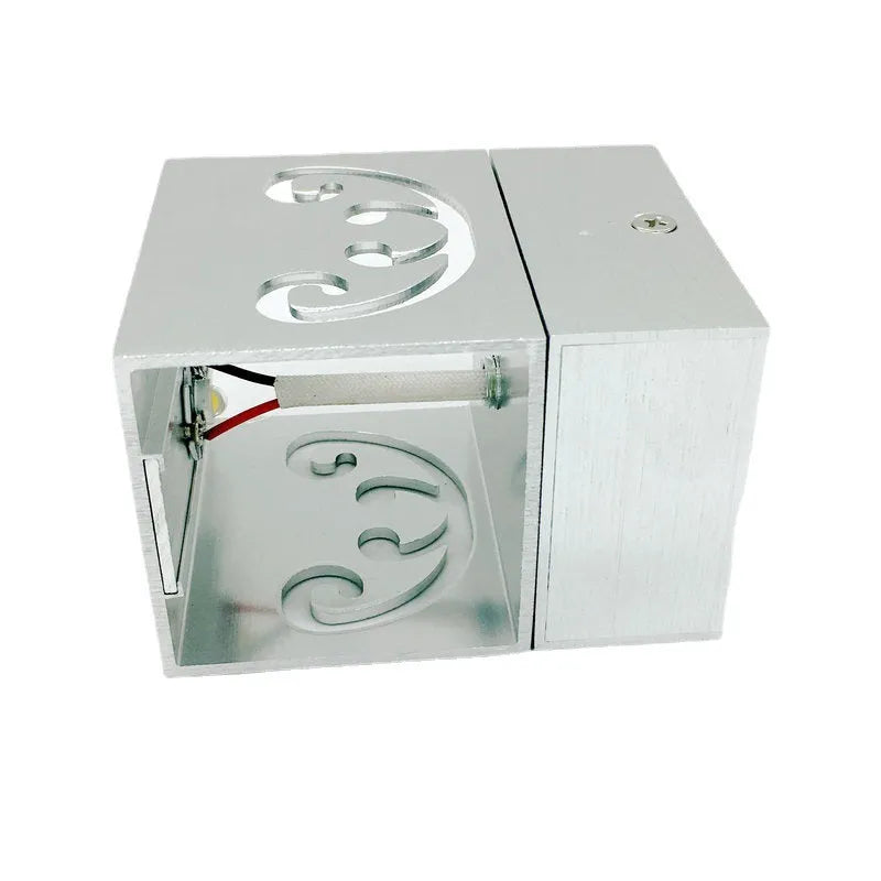 Modern aluminium butterfly-shaped LED wall lamp with remote control for seven colour options.