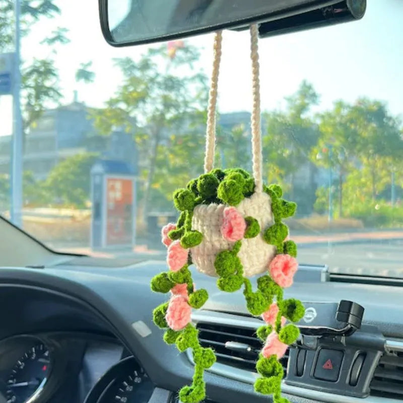Green and white knitted wool plant ornament for car dashboard with hanging cord