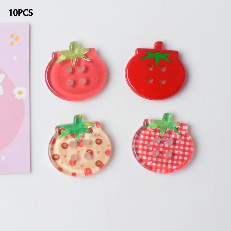 A pack of medium-sized plastic tomato button ornaments in mixed colours including red plaid and cherry tomato print.