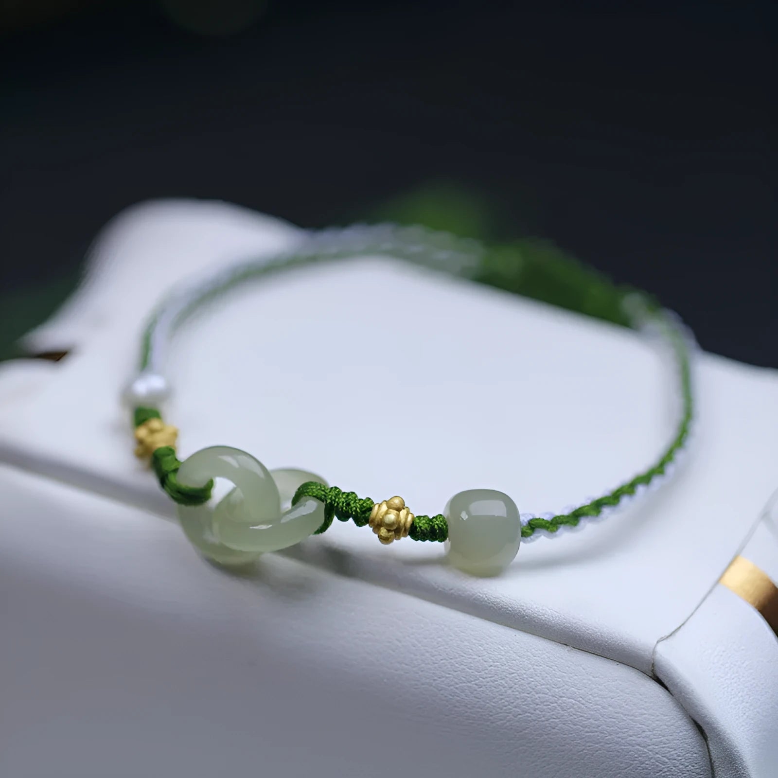 Hetian jade woven bracelet with flexible wire construction and hollow out national tide design elements