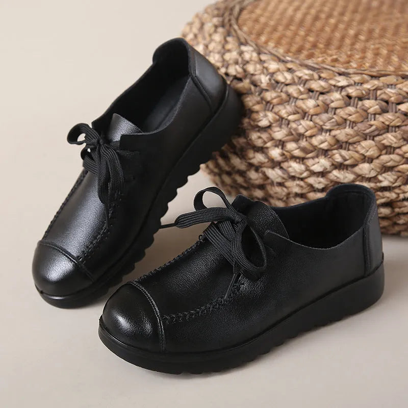 Women's black flat work shoes with microfiber upper, round toe, front lacing and anti-slip polyurethane sole
