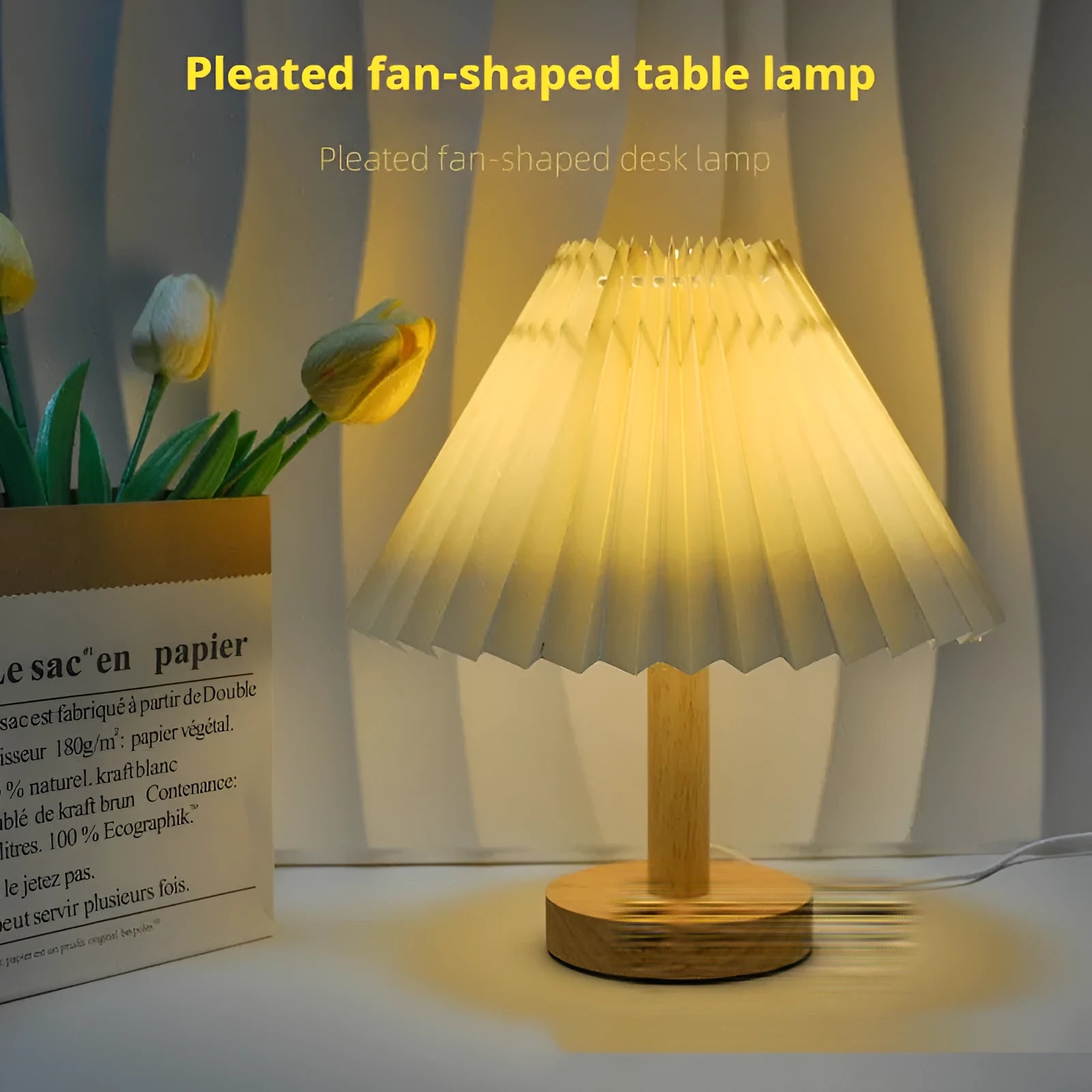 Vintage red pleated umbrella-shaped bedside lamp with remote control on a wooden nightstand.