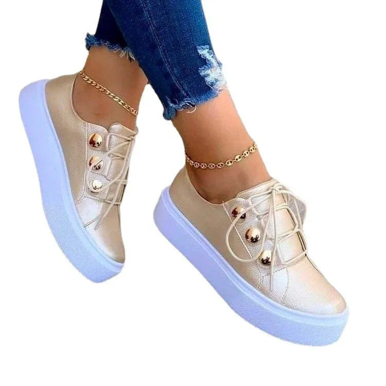 Women's white lace-up flats sneakers with decorative rivet detailing on round toe artificial PU upper