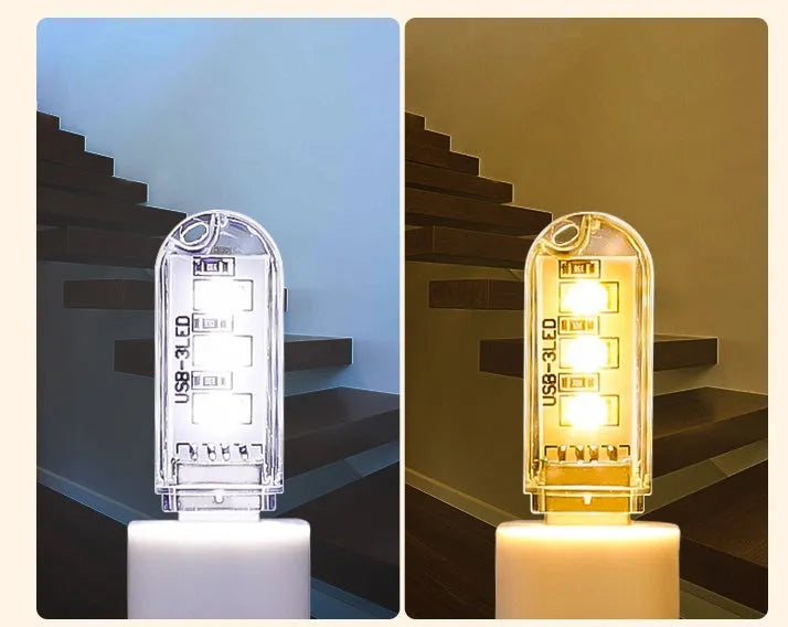 Small white USB-powered LED night light showing warm and white light options on a table.